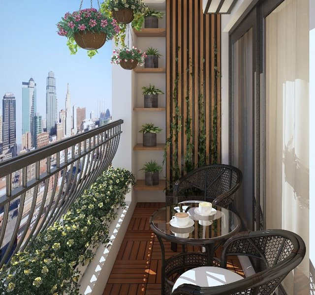 Ban công căn hộ 50m2 thiết kế thư giãn với ghế mây, bàn trà nhỏ và cây xanh treo tường tạo không gian chill ngoài trời