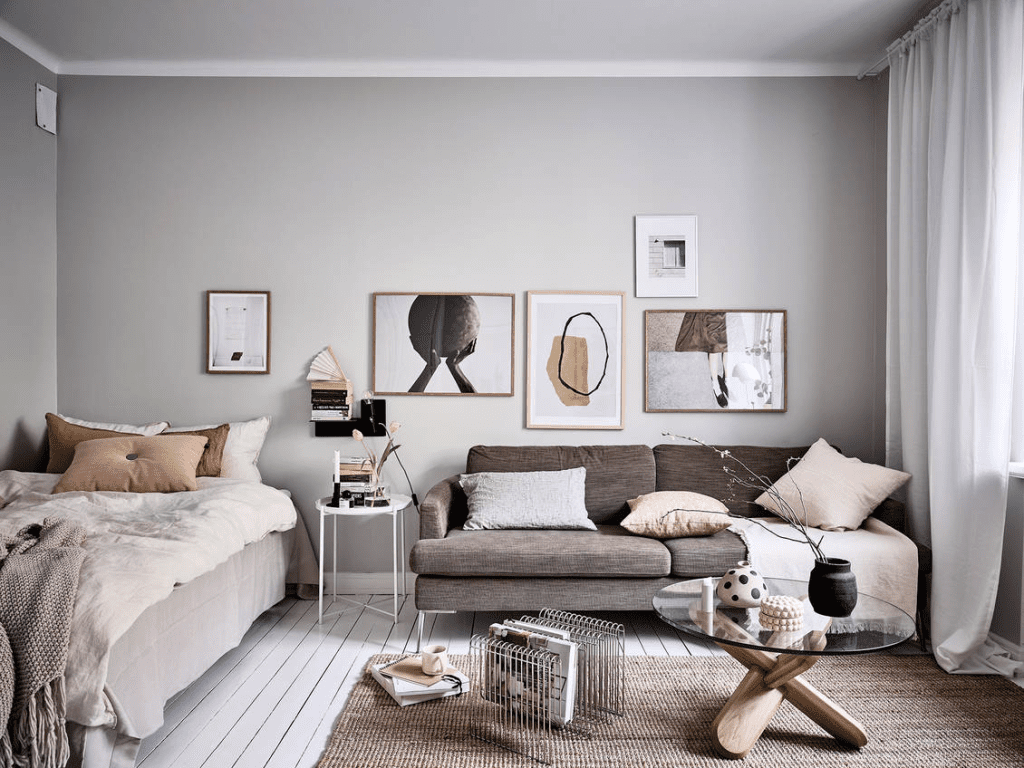 Căn hộ studio 30m2 cho người độc thân với thiết kế mở, kết hợp giường ngủ, sofa và góc làm việc trong cùng một không gian
