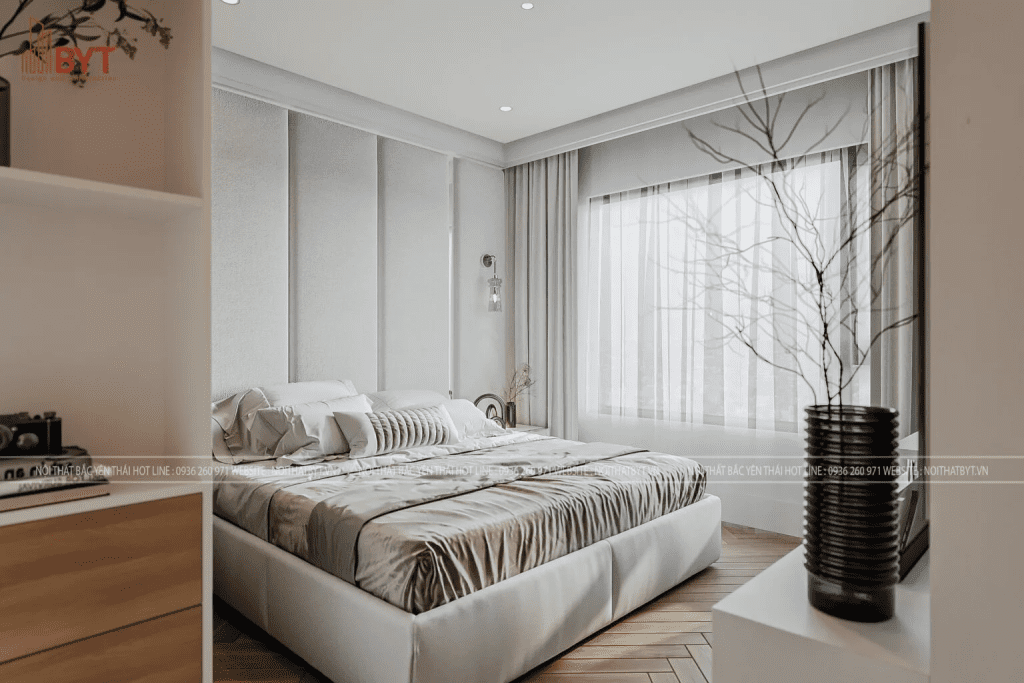 Phòng ngủ chính căn hộ 50m2 thiết kế tinh giản, sử dụng tông trắng - be nhẹ nhàng, kết hợp rèm và cửa kính lớn lấy sáng