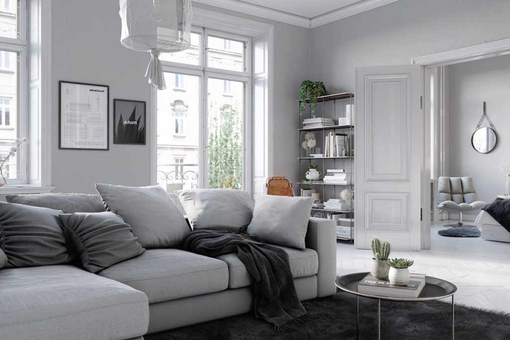 Mẫu thiết kế nội thất căn hộ 64m2 phong cách Bắc Âu với ghế vải và cây xanh trang trí.