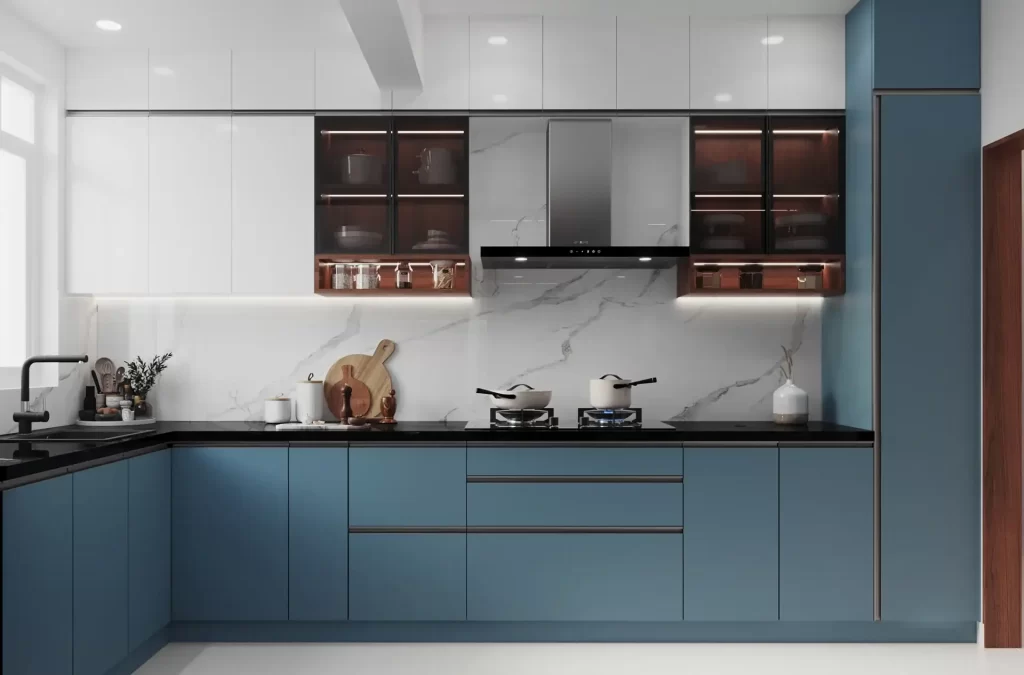Phòng bếp được thiết kế với tủ chữ L gỗ công nghiệp xanh
